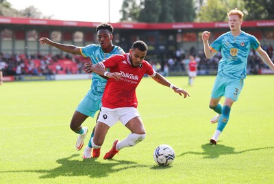 280821 - Salford City v Newport County, Sky Bet League 2 - Timmy Abraham of Newport County competes with Tyreik Wright of Salford City for the ball