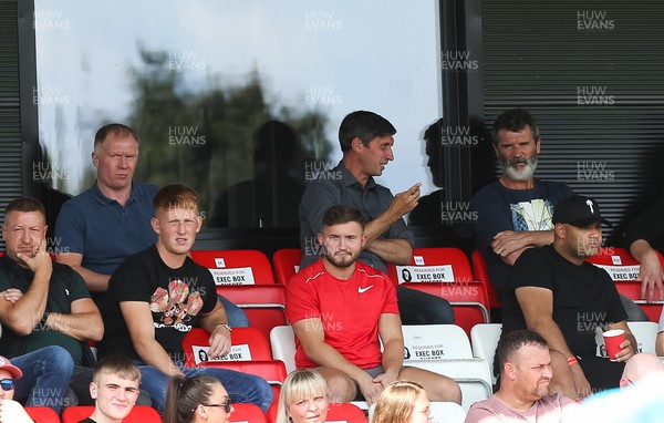 280821 - Salford City v Newport County, Sky Bet League 2 - Former Manchester United players Paul Scholes, back left and Roy Keane, back right, watch the match