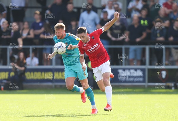280821 - Salford City v Newport County, Sky Bet League 2 - Cameron Norman of Newport County and Ian Henderson of Salford City compete for the ball