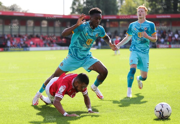 280821 - Salford City v Newport County, Sky Bet League 2 - Timmy Abraham of Newport County competes with Tyreik Wright of Salford City for the ball