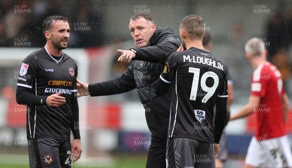 300923 - Salford City v Newport County - Sky Bet League 2 - Manager Graham Coughlan of Newport County gives instructions to Shane McLoughlin of Newport County and Aaron Wildig of Newport County