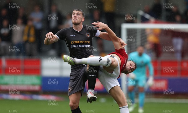 300923 - Salford City v Newport County - Sky Bet League 2 - Ryan Delaney of Newport County tussles with Matt Smith of Salford City