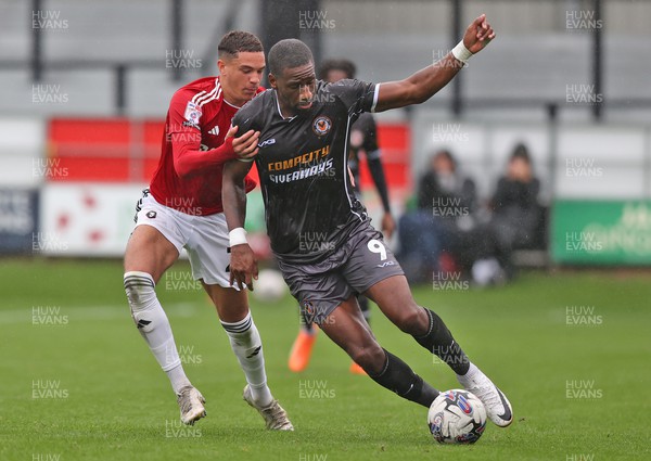 300923 - Salford City v Newport County - Sky Bet League 2 - Omar Bogle of Newport County is held by Ethan Ingram of Salford City 