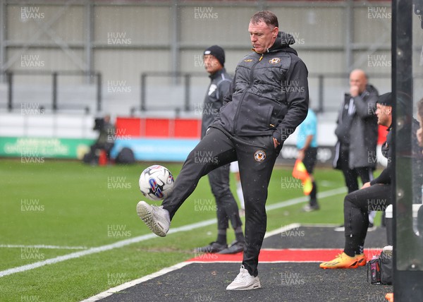 300923 - Salford City v Newport County - Sky Bet League 2 - Manager Graham Coughlan of Newport County juggles the match ball back into play