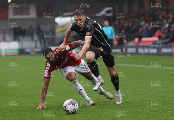 300923 - Salford City v Newport County - Sky Bet League 2 - Adrian Mariappa of Salford City tries to halt Nathan Wood of Newport County