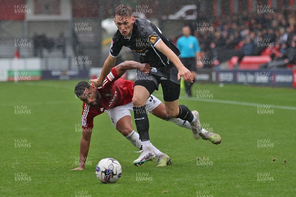 300923 - Salford City v Newport County - Sky Bet League 2 - Adrian Mariappa of Salford City tries to halt Nathan Wood of Newport County