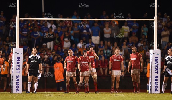 230617 - Samoa v Wales - Wales players look on after a Samoa try
