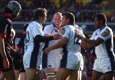 08.10.06 - Saracens v Cardiff Blues - EDF Energy Cup - Blues players congratulate Marc Stcherbina (12) on try 