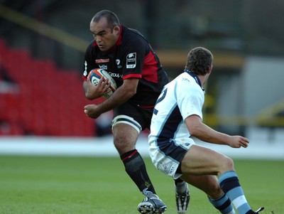 08.10.06  Saracens v Cardiff Blues  Saracens Simon Raiwalui takes on Marc Stcherbina.  