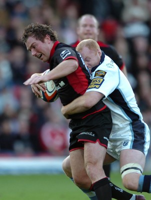 08.10.06  Saracens v Cardiff Blues  Saracens Glen jackson is tackled by Martyn Williams.  