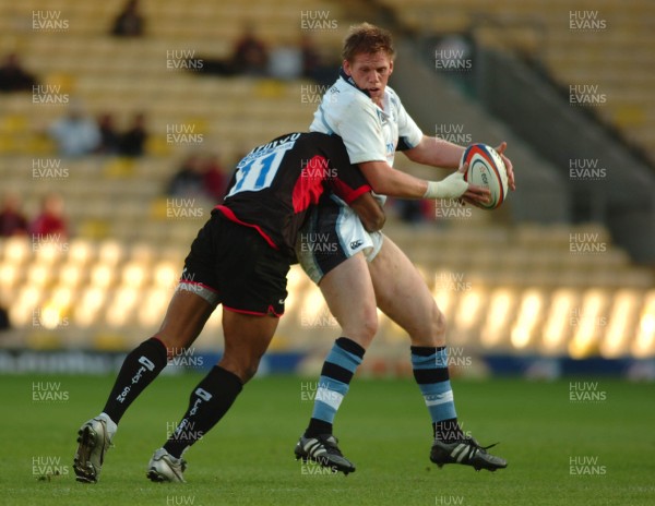 08.10.06 - Saracens v Cardiff Blues - EDF Energy Cup - Blues Rhys Thomas is tackled by Kameli Ratuvou 