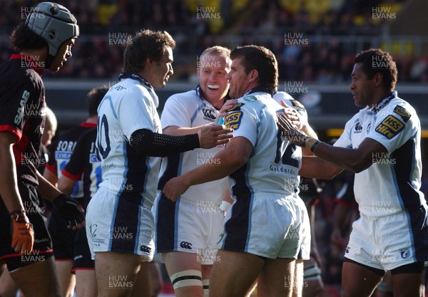 08.10.06 - Saracens v Cardiff Blues - EDF Energy Cup - Blues players congratulate Marc Stcherbina (12) on try 