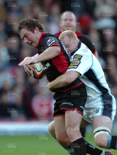 08.10.06  Saracens v Cardiff Blues  Saracens Glen jackson is tackled by Martyn Williams.  