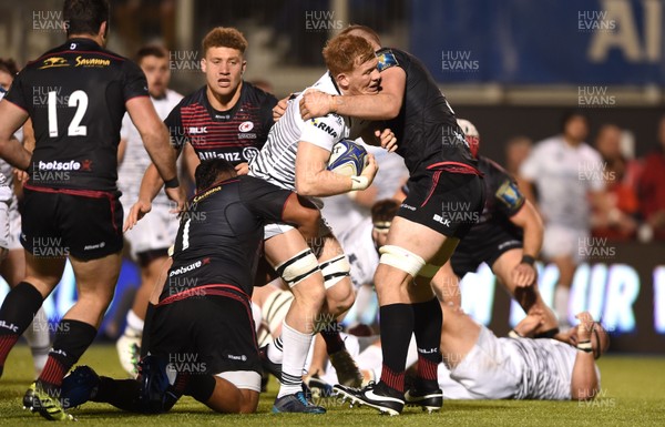 211017 - Saracens v Ospreys - European Rugby Champions Cup - Sam Cross of Ospreys is tackled by Mako Vunipola and George Kruis of Saracens