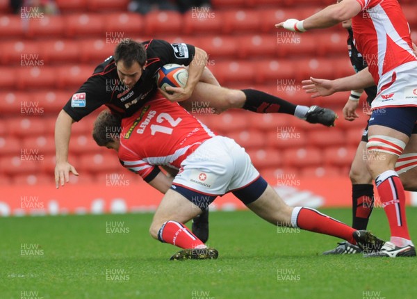 05.10.08 - EDF Energy Cup Saracens v Llanelli Scarlets Saracens' Edd Thrower is tackled by Scarlets' Gavin Evans 