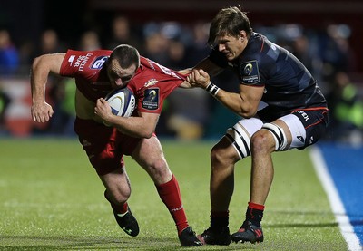 221016 - Saracens v Scarlets - European Rugby Champions Cup - Ken Owens of Scarlets is tackled by Michael Rhodes of Saracens