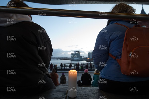 130321 Sarah Everard Vigil, Cardiff - Candles are lit as people gather at the Welsh Government Senedd Building in Cardiff Bay at a vigil after the murder of Sarah Everard and the resulting campaign for the safety of women