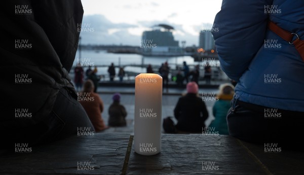 130321 Sarah Everard Vigil, Cardiff - Candles are lit as people gather at the Welsh Government Senedd Building in Cardiff Bay at a vigil after the murder of Sarah Everard and the resulting campaign for the safety of women