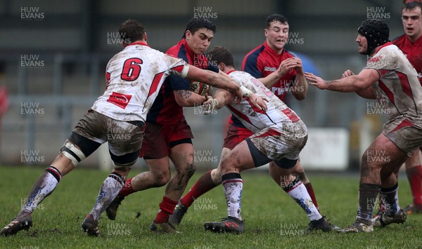 200118 - Scarlets Premiership Select v Ulster A - B&I Cup - Jacob Botica of Scarlets is tackled by Caleb Montgomery and John Andrew of Ulster