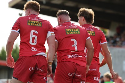 060925 - Scarlets Preseason Friendlies - Scarlets play preseason friendlies v Regional SRC Clubs Llandovery RFC and Carmarthen Quins RFC - Osian Williams Harri O Connor and Ellis Mee of Scarlets  