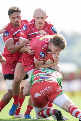 060925 - Scarlets Preseason Friendlies - Scarlets play preseason friendlies v Regional SRC Clubs Llandovery RFC and Carmarthen Quins RFC - Ellis Mee of Scarlets is stopped by Adam Warren of Llandovery with Ioan Nicholas and Dan Davies in support 