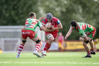 060925 - Scarlets Preseason Friendlies - Scarlets play preseason friendlies v Regional SRC Clubs Llandovery RFC and Carmarthen Quins RFC - Tristan Davies of Scarlets is tackled by Joe Powell of Llandovery  