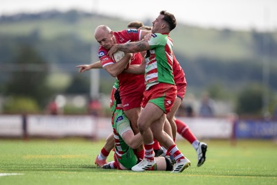 060925 - Scarlets Preseason Friendlies - Scarlets play preseason friendlies v Regional SRC Clubs Llandovery RFC and Carmarthen Quins RFC - Ioan Nicholas of Scarlets and Rhodri Jones of Llandovery tangle  