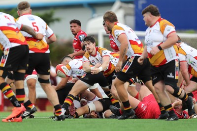 060925 - Scarlets Preseason Friendlies - Scarlets play preseason friendlies v Regional SRC Clubs Llandovery RFC and Carmarthen Quins RFC - Rhodri Davies of Carmarthen Quins gets the ball away  