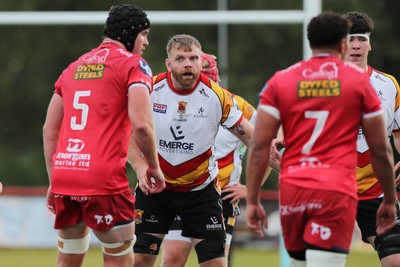 060925 - Scarlets Preseason Friendlies - Scarlets play preseason friendlies v Regional SRC Clubs Llandovery RFC and Carmarthen Quins RFC - Tom Phillips of Carmarthen Quins keeps an eye on Jac Price of Scarlets  