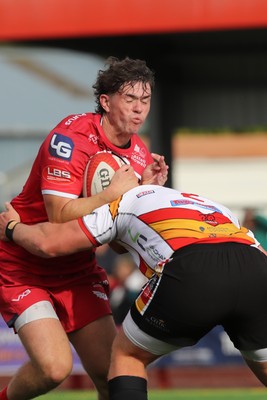 060925 - Scarlets Preseason Friendlies - Scarlets play preseason friendlies v Regional SRC Clubs Llandovery RFC and Carmarthen Quins RFC - Gabe Mcdonald of Scarlets is stopped by Lewis Morgan of Carmarthen Quins  