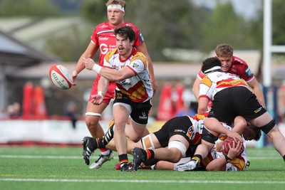 060925 - Scarlets Preseason Friendlies - Scarlets play preseason friendlies v Regional SRC Clubs Llandovery RFC and Carmarthen Quins RFC - Rhodri Davies of Carmarthen Quins gets the ball away   
