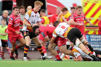 060925 - Scarlets Preseason Friendlies - Scarlets play preseason friendlies v Regional SRC Clubs Llandovery RFC and Carmarthen Quins RFC - Saul Hurley of Scarlets is tackled by Lewys Millin of Carmarthen Quins   