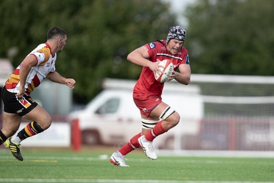 060925 - Scarlets Preseason Friendlies - Scarlets play preseason friendlies v Regional SRC Clubs Llandovery RFC and Carmarthen Quins RFC - Tristan Davies of Scarlets on the charge  
