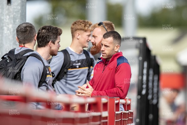 060925 - Scarlets Preseason Friendlies - Scarlets play preseason friendlies v Regional SRC Clubs Llandovery RFC and Carmarthen Quins RFC - Gareth Davies of Scarlets chats to Rhodri Davies of Carmarthen Quins   