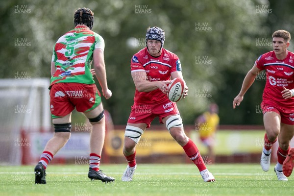 060925 - Scarlets Preseason Friendlies - Scarlets play preseason friendlies v Regional SRC Clubs Llandovery RFC and Carmarthen Quins RFC - Tristan Davies of Scarlets runs at Dylan Alford of Llandovery  