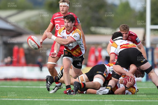 060925 - Scarlets Preseason Friendlies - Scarlets play preseason friendlies v Regional SRC Clubs Llandovery RFC and Carmarthen Quins RFC - Rhodri Davies of Carmarthen Quins gets the ball away   