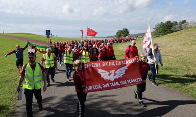 270925 - Scarlets Fans Protest - Scarlets fans march through Llanelli in protest against the Welsh Rugby Union’ s protective plan to get rid of possibly two of the Welsh rugby regions The march finished at Parc y Scarlets ahead of the Scarlets v Munster, United Rugby Championship match