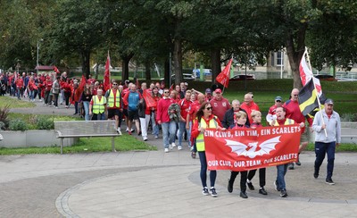 270925 - Scarlets Fans Protest - Scarlets fans march through Llanelli in protest against the Welsh Rugby Union’ s protective plan to get rid of possibly two of the Welsh rugby regions The march finished at Parc y Scarlets ahead of the Scarlets v Munster, United Rugby Championship match