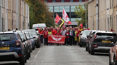 270925 - Scarlets Fans Protest - Scarlets fans march through Llanelli in protest against the Welsh Rugby Union’ s protective plan to get rid of possibly two of the Welsh rugby regions The march finished at Parc y Scarlets ahead of the Scarlets v Munster, United Rugby Championship match