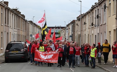 270925 - Scarlets Fans Protest - Scarlets fans march through Llanelli in protest against the Welsh Rugby Union’ s protective plan to get rid of possibly two of the Welsh rugby regions The march finished at Parc y Scarlets ahead of the Scarlets v Munster, United Rugby Championship match