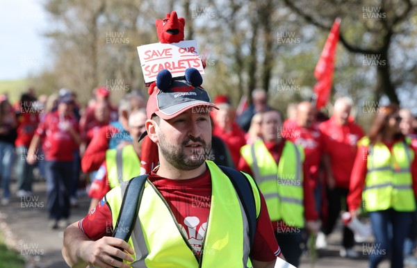 270925 - Scarlets Fans Protest - Scarlets fans march through Llanelli in protest against the Welsh Rugby Union’ s protective plan to get rid of possibly two of the Welsh rugby regions The march finished at Parc y Scarlets ahead of the Scarlets v Munster, United Rugby Championship match