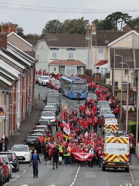 270925 - Scarlets Fans Protest - Scarlets fans march through Llanelli in protest against the Welsh Rugby Union’ s protective plan to get rid of possibly two of the Welsh rugby regions The march finished at Parc y Scarlets ahead of the Scarlets v Munster, United Rugby Championship match