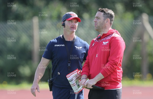240821 - Scarlets Training session - Scarlets head of physical performance Nigel Ashley-Jones, left with Head of Technical Performance Joe Lewis during training session