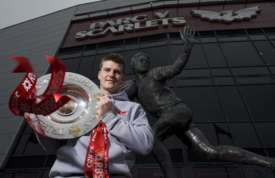 280212 - Scarlets Triple Crown Photocall -Scott Williams of Wales and Scarlets with the triple crown next to the Ray Gravell statue outside Parc y Scarlets