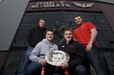 280212 - Scarlets Triple Crown Photocall -Rhys Priestland, Scott Williams, Jonathan Davies and Ken Owens of Wales and Scarlets with the triple crown next to the Ray Gravell statue outside Parc y Scarlets