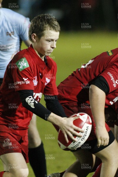 28.10.09 Scarlets Under 16's v Ospreys Under 16's - Regional Age Grade Championship - scarlets' scrum half Conor Lloyd kicks to touch. 