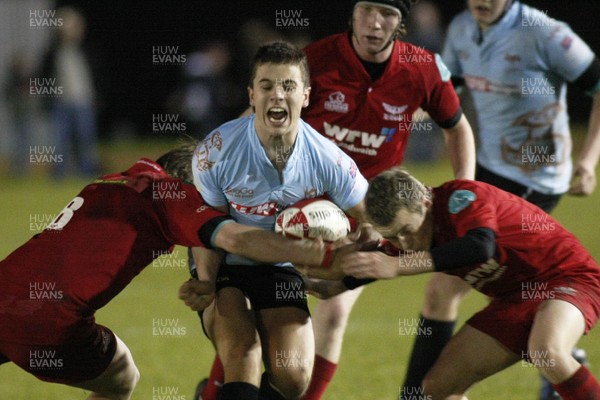 28.10.09 Scarlets Under 16's v Ospreys Under 16's - Regional Age Grade Championship - Ospreys' winger Sam M Davies gets sandwiched. 