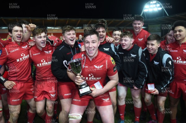 060218 - Scarlets Under 18s v Blues North Under 18s - Gethin Davies of Scarlets lifts the trophy