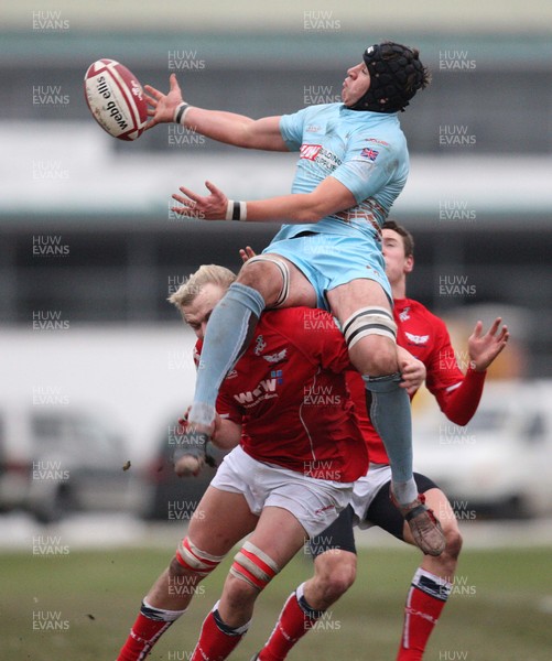 11.01.09 - Scarlets U18 v Ospreys U18, WRU Under 18 Regional Championship Final, Swansea. -  Ospreys' Ben Thomas gets above Scarlets' Luke Hamilton as he goes for the ball 