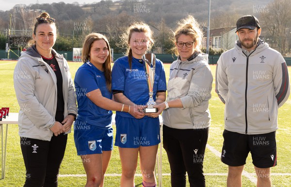 190223 - Scarlets U18 Women v Cardiff Rugby U18 Women, WRU Women’s U18 Age Grade Championship - Cardiff co-captains Riley Stanger and Katie Sims are presented with the WRU Women’s U18 Age Grade Championship Trophy by Catrina Nicholas-McLaughlin, Wales U18 Women head coach, along with Siwan Lillicrap, Performance Pathway Manager and coach (women), and Oliver Wilson, Wales U18 Women assistant coach